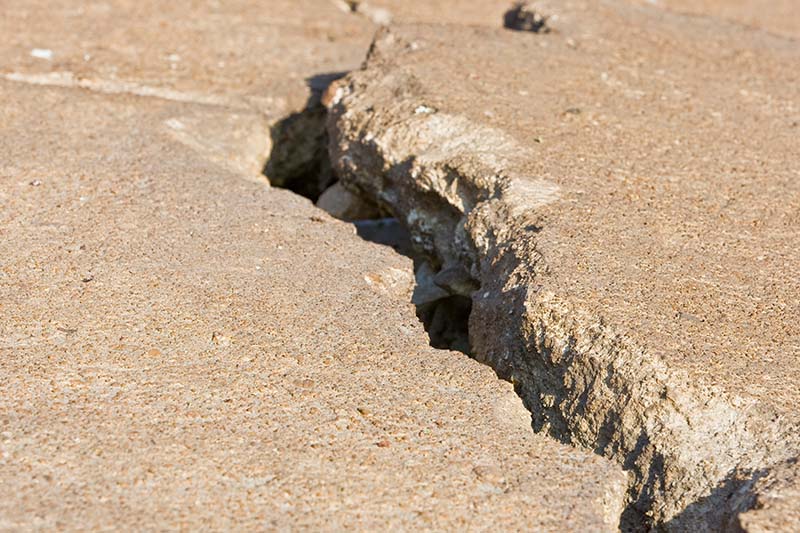 Sinkholes cause cracked concrete like this